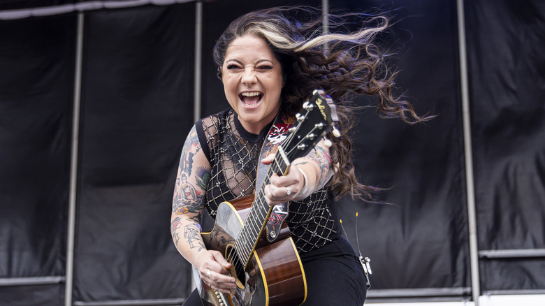 Ashley McBryde playing guitar