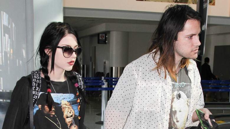 Frances Bean Cobain and Isaiah Silva leaving an airport