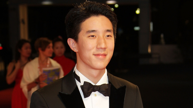 Jaycee Chan smiling at the Venice Film Festival