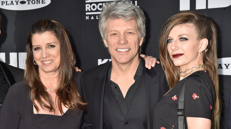 Dorothea Hurley, Jon Bon Jovi, and Stephanie Rose Bongiovi posing on step-and-repeat