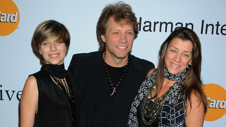 Stephanie Rose Bongiovi, Jon Bon Jovi, and Dorothea Hurley posing on step-and-repeat