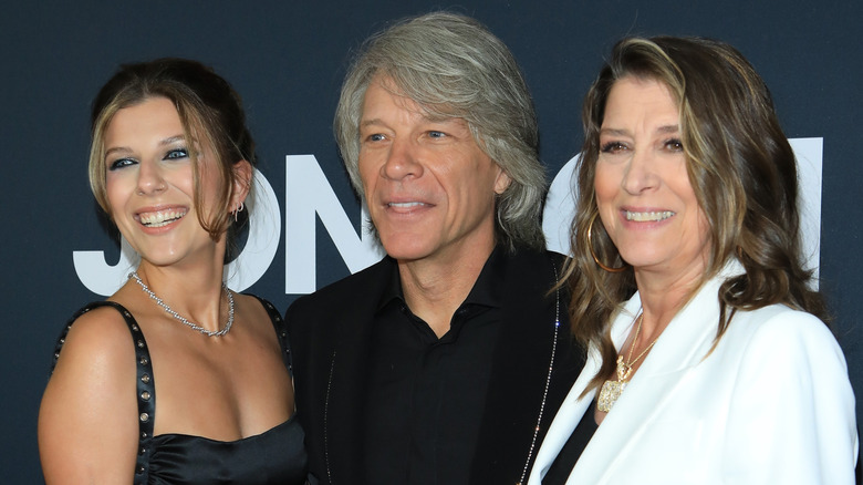 Stephanie Rose Bongiovi, Jon Bon Jovi, and Dorothea Hurley posing on step-and-repeat