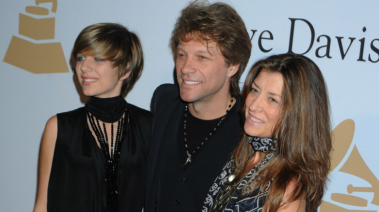 Stephanie Rose Bongiovi, Jon Bon Jovi, and Dorothea Hurley posing on step-and-repeat