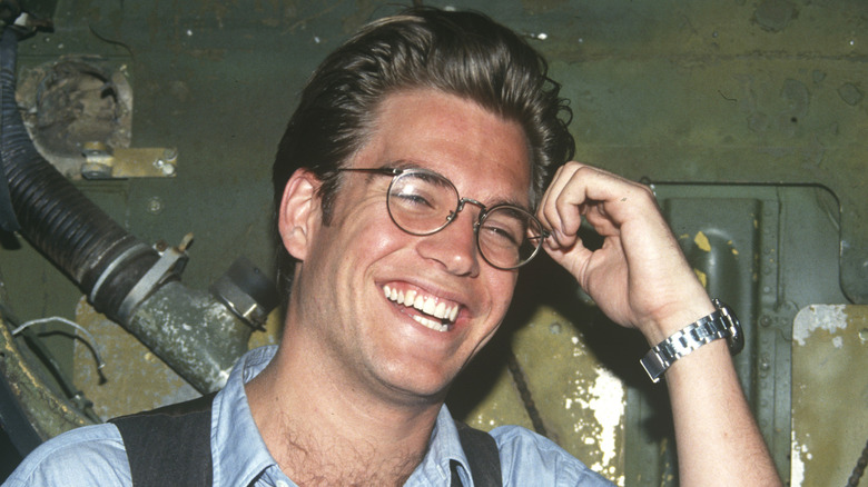 Michael Weatherly wearing glasses and smiling in 1993