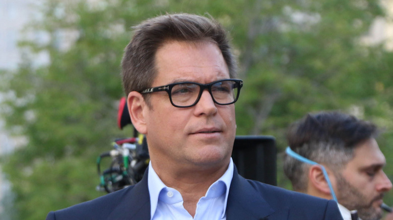 Michael Weatherly wearing glasses on the "Bull" set