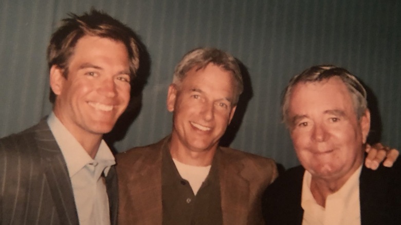 Michael Weatherly, Mark Harmon and Michael Weatherly Jr. taking a picture on NCIS set