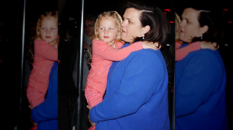 Chelsea O'Donnell as a child being carried by her mother Rosie O'Donnell