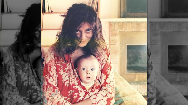 Susan Sarandon holding baby Eva Amurri inside her jacket