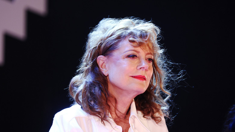 Susan Sarandon in a white shirt with red lipstick