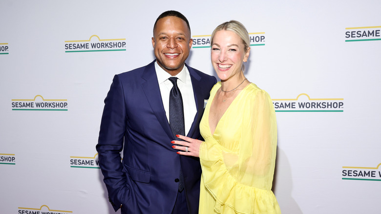 Craig Melvin and wife Lindsay Czarniak smile at Sesame Workshop