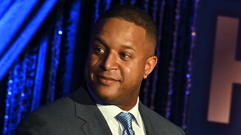 Craig Melvin posing with his brothers