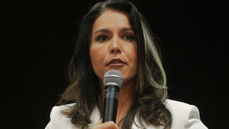 Tulsi Gabbard speaking into a microphone