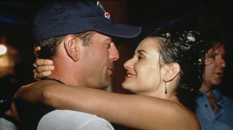 Bruce Willis and Demi Moore embracing