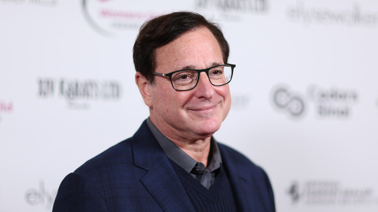 Bob Saget in a checked tuxedo