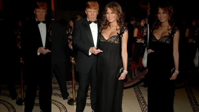 Donald Trump pointing to Melania Trump's pregnant belly