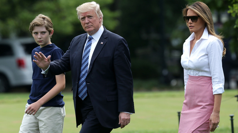 Barron Trump walking with Donald and Melania Trump