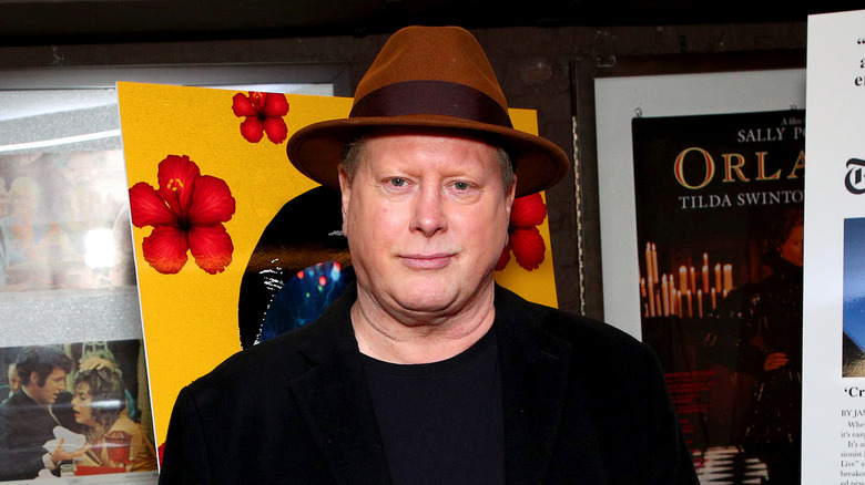 Darrell Hammond posing in a brown fedora 