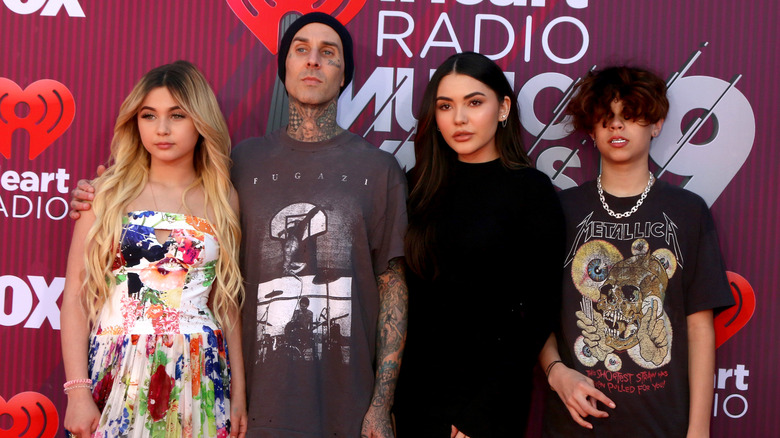 Travis Barker and his kids posing