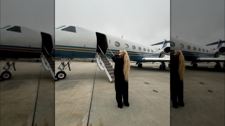 Alabama Barker on a tarmac