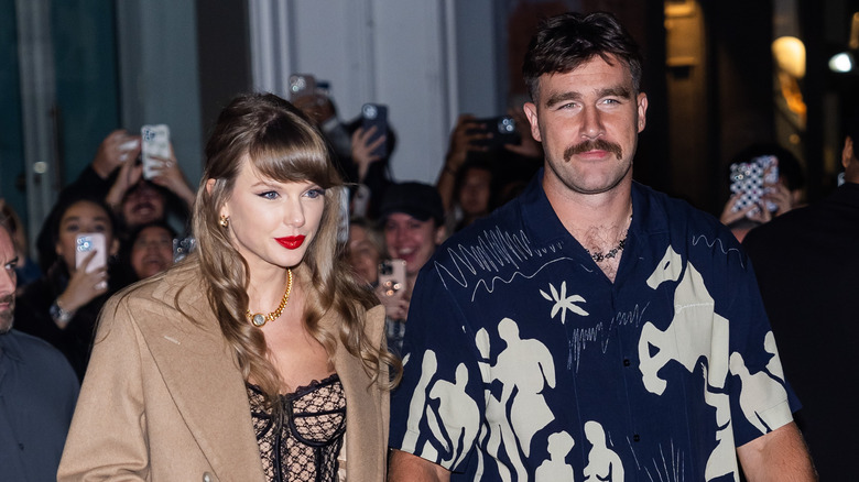 Taylor Swift and Travis Kelce walking together in New York City