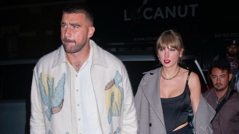 Travis Kelce and Taylor Swift walking together