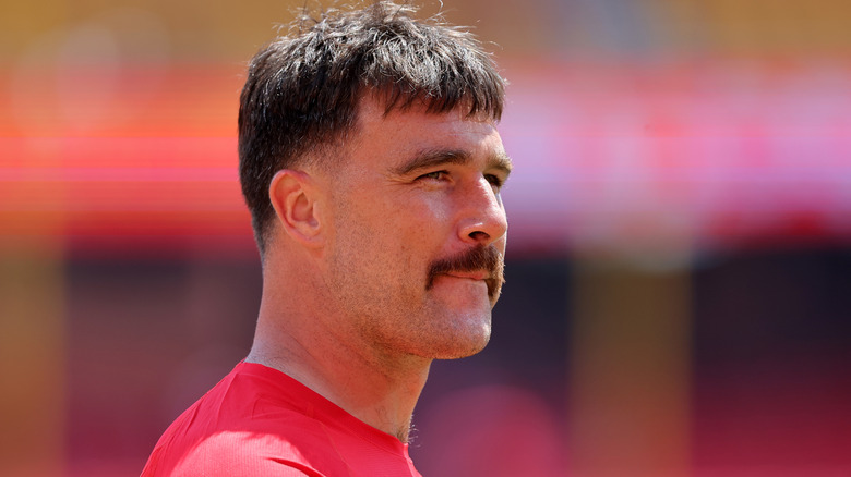 Travis Kelce long hair and mustache August 2024