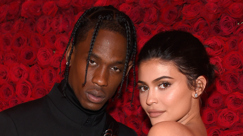 Kylie Jenner and Travis Scott snuggle up at an event