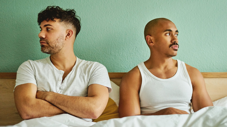 Couple in bed arguing