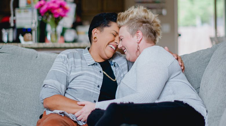 Couple holding each other and laughing