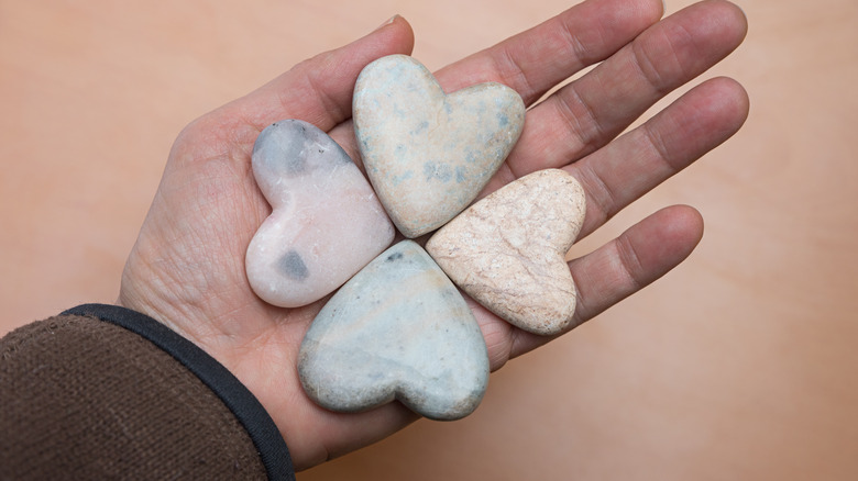 Ornamental soapstones in palm