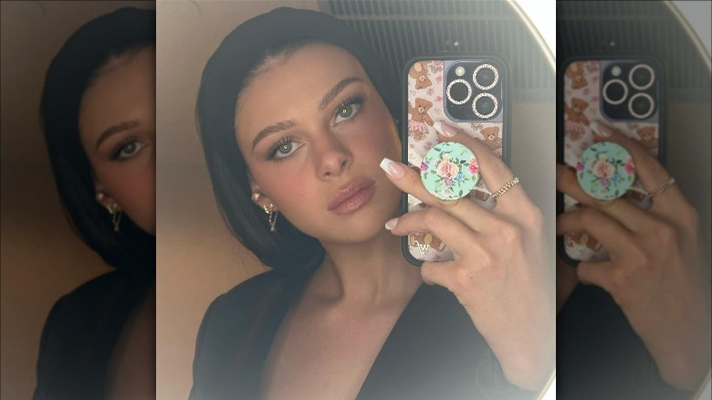 nicola peltz black headband selfie