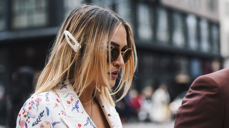 blonde woman wearing pearl clip