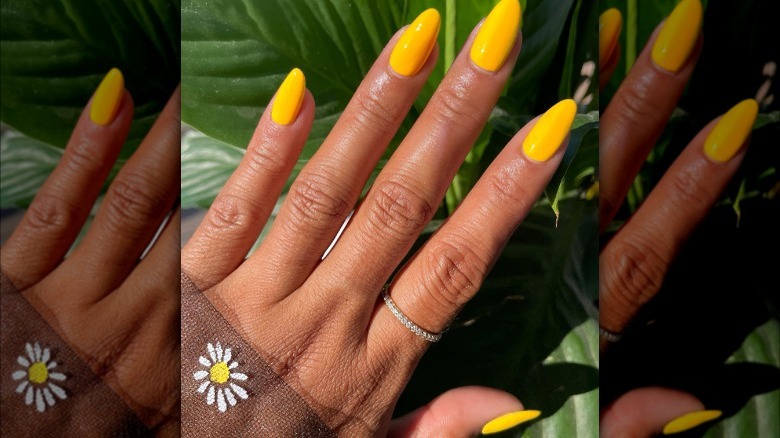 hand with canary yellow nails