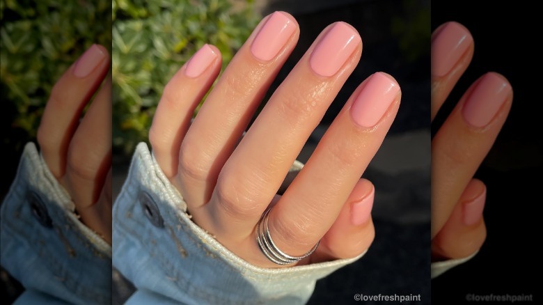 hand with soft peach nails