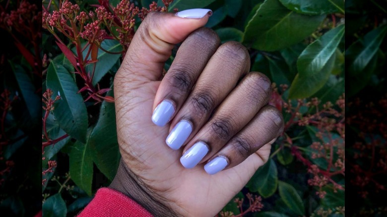 hand with lilac nails