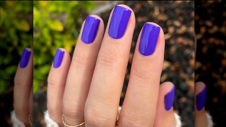 Hand with purple nails 