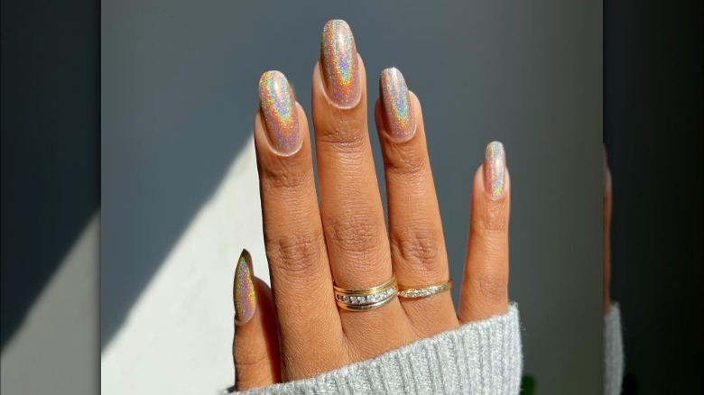 hand with iridescent nails