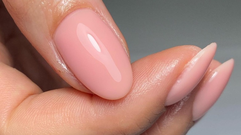 blush-colored polish on nails