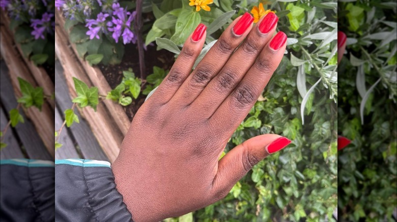 hand with red-painted nails