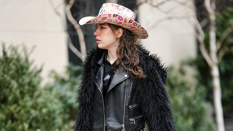 Girl in kiss print cowboy hat