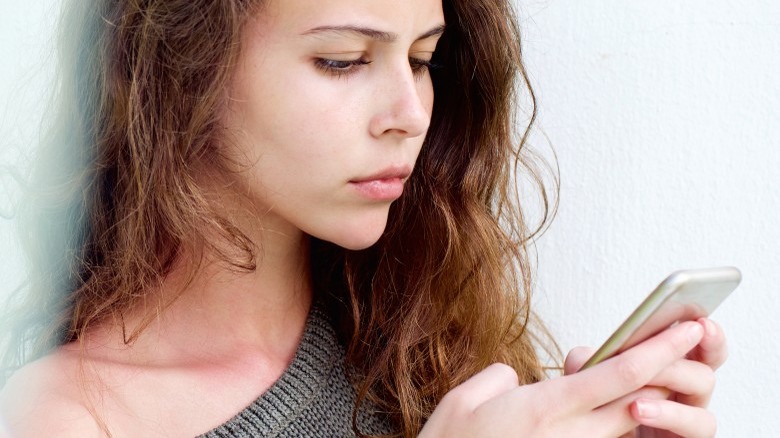 woman looking at phone