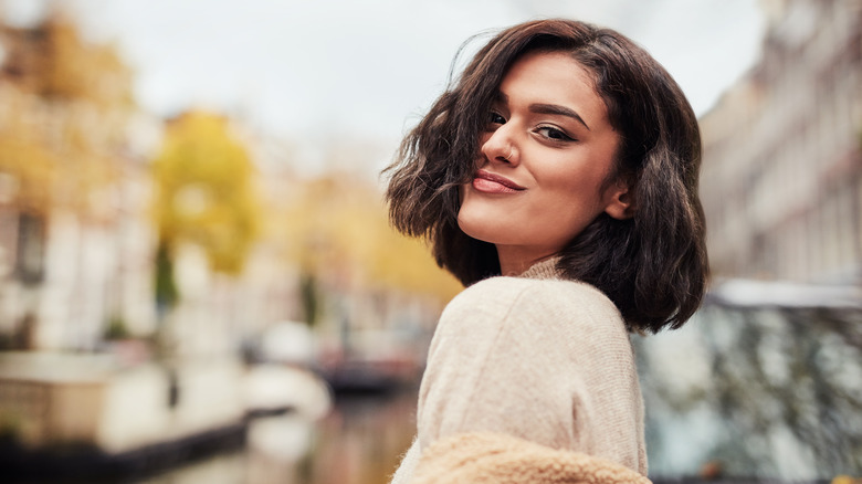 Woman with short hair smiles