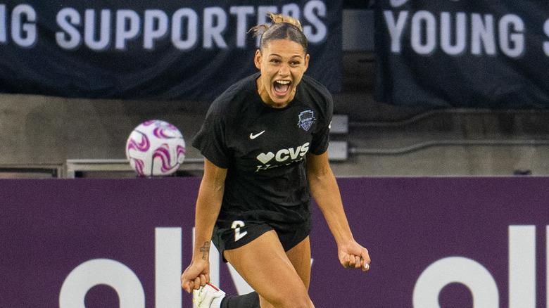 Trinity Rodman smiling while playing soccer