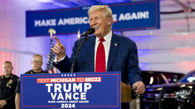 Donald Trump big smile podium