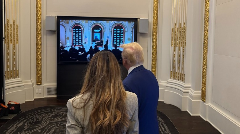 President Trump and Melania Trump watch the New York Stock Exchange on TV