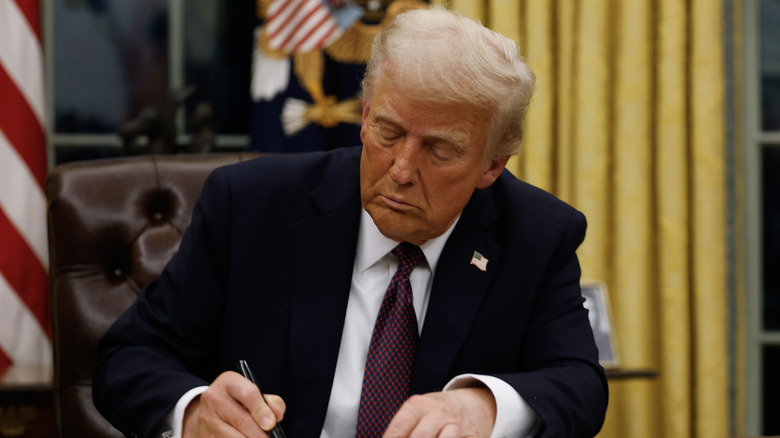 Donald Trump signing executive orders in the Oval office, Joe Biden's former office