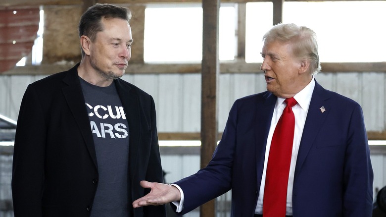 Donald Trump offering hand to Elon Musk