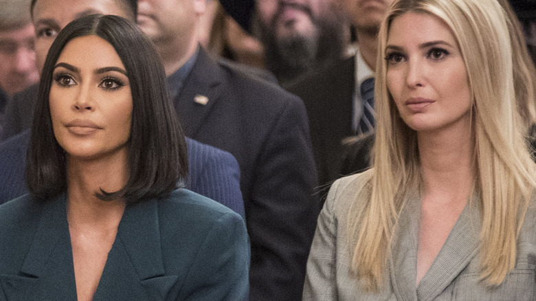 Kim Kardashian and Ivanka Trump sit side by side