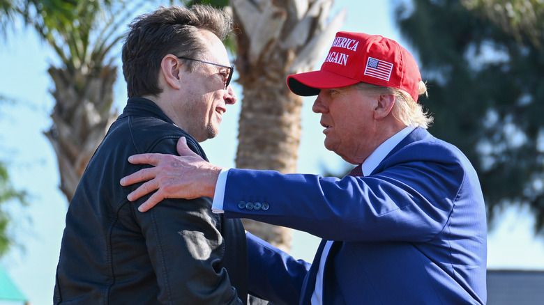 Elon Musk and Donald Trump embracing