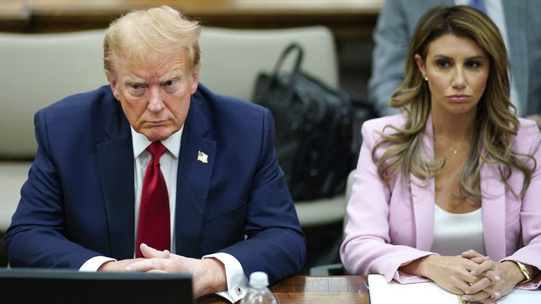 Donald Trump sits at the defense table with his attorneys